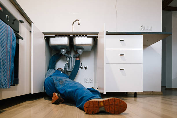 Professional Drain Cleaning technician working in Starkville, MS